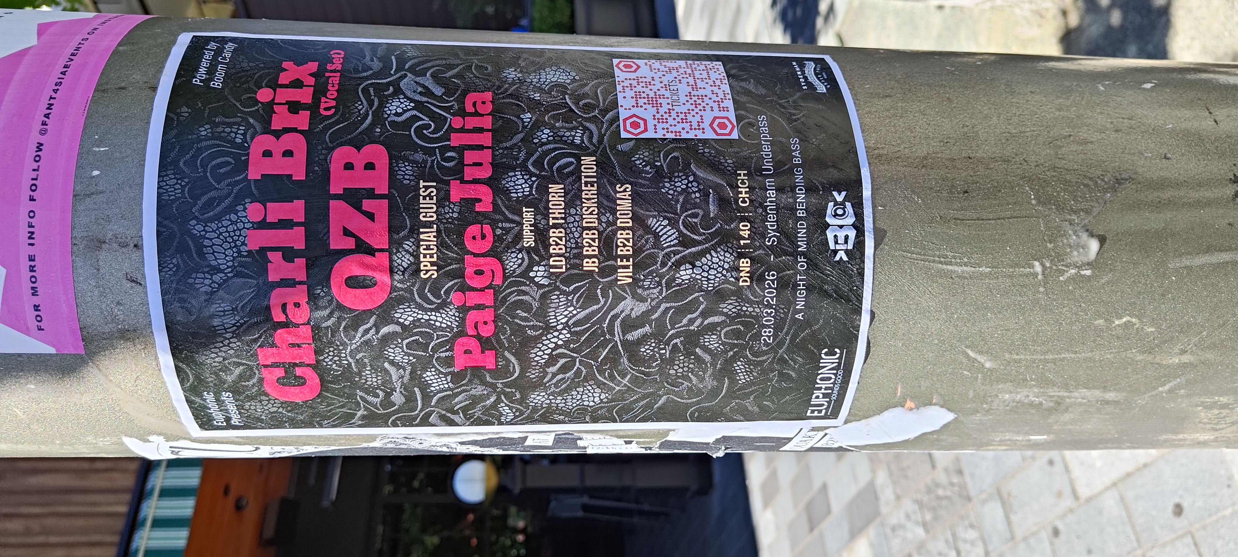 Charli Brix event poster with custom pink QR code on street pole